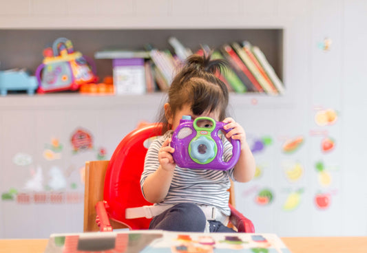 Little Girl playing with toy