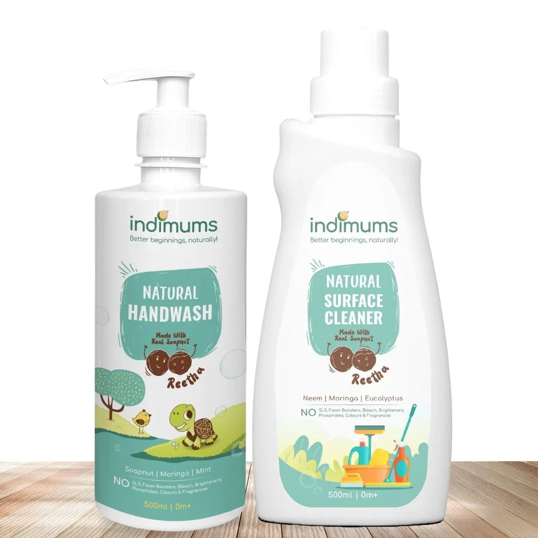 Two bottles of Indimums Natural Handwash and Surface Cleaner on a wooden surface