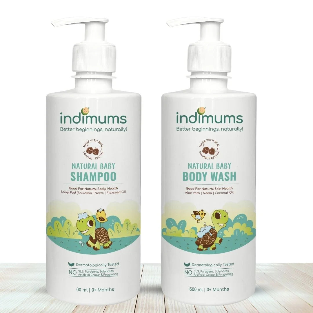 Two bottles of Indimums Natural Baby Shampoo & Body Wash on a wooden surface with a white background