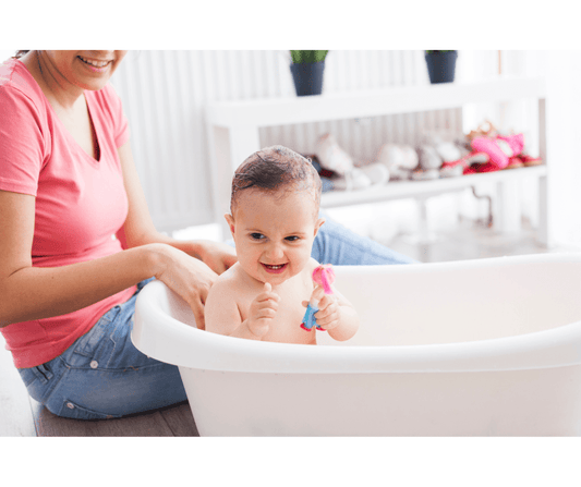 Mother giving baby bath for shampoo side effects guidance
