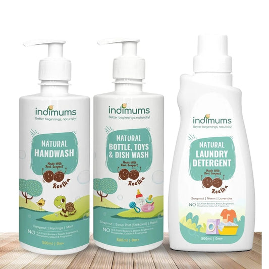 Three bottles of Indimums Natural Handwash, Laundry Detergent & Bottle, Toys & Dish Wash on a wooden surface with a white background
