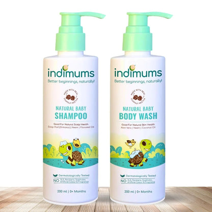 Two bottles of Indimums Natural Baby Shampoo and Body Wash on a wooden surface with a white background