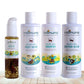 Three bottles of Indimums natural Baby Shampoo, Body Wash , Bottom Wash and baby hair oil on a wooden surface with a white background