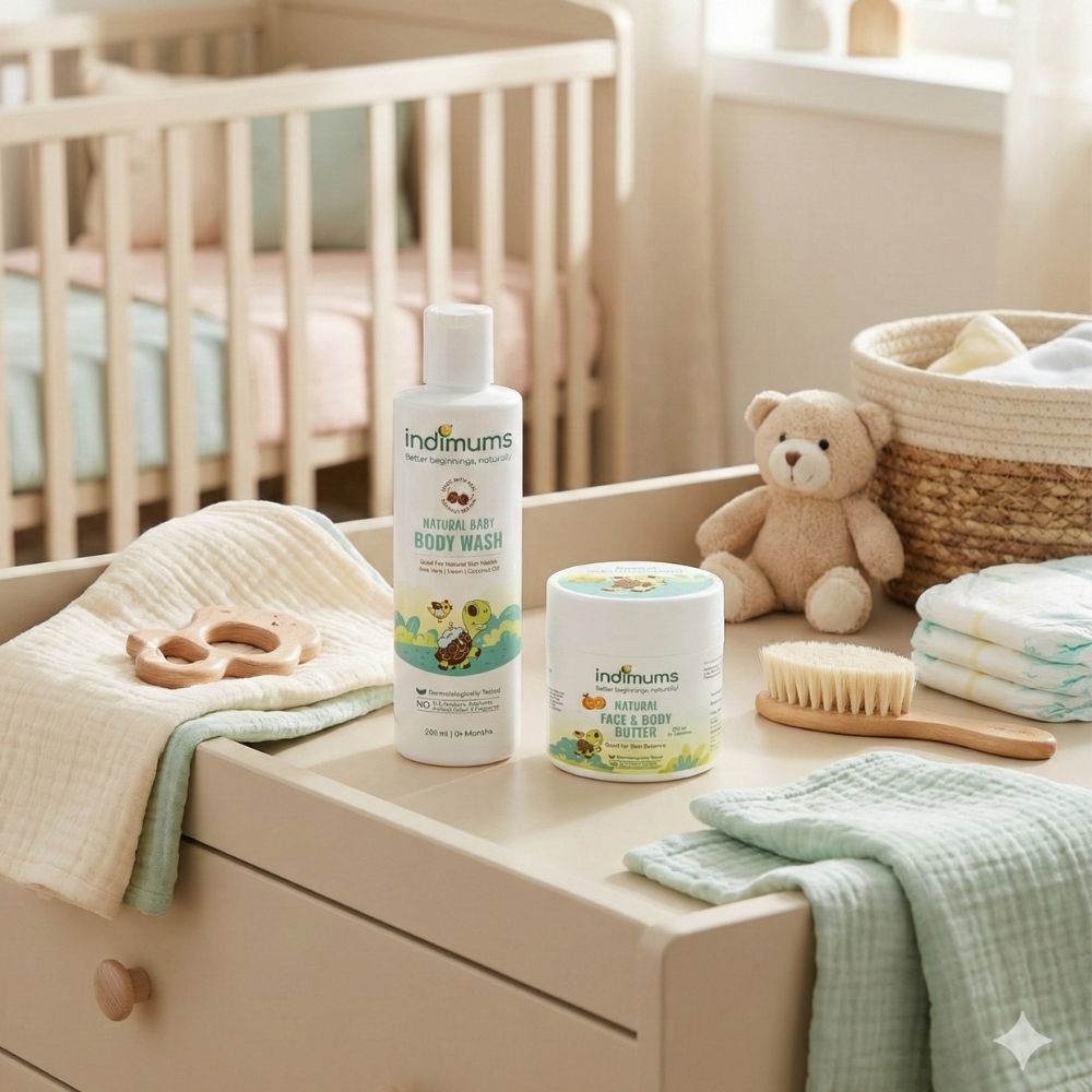 Indimums baby body wash & face & body butter on a changing table with a teddy bear and baby items.