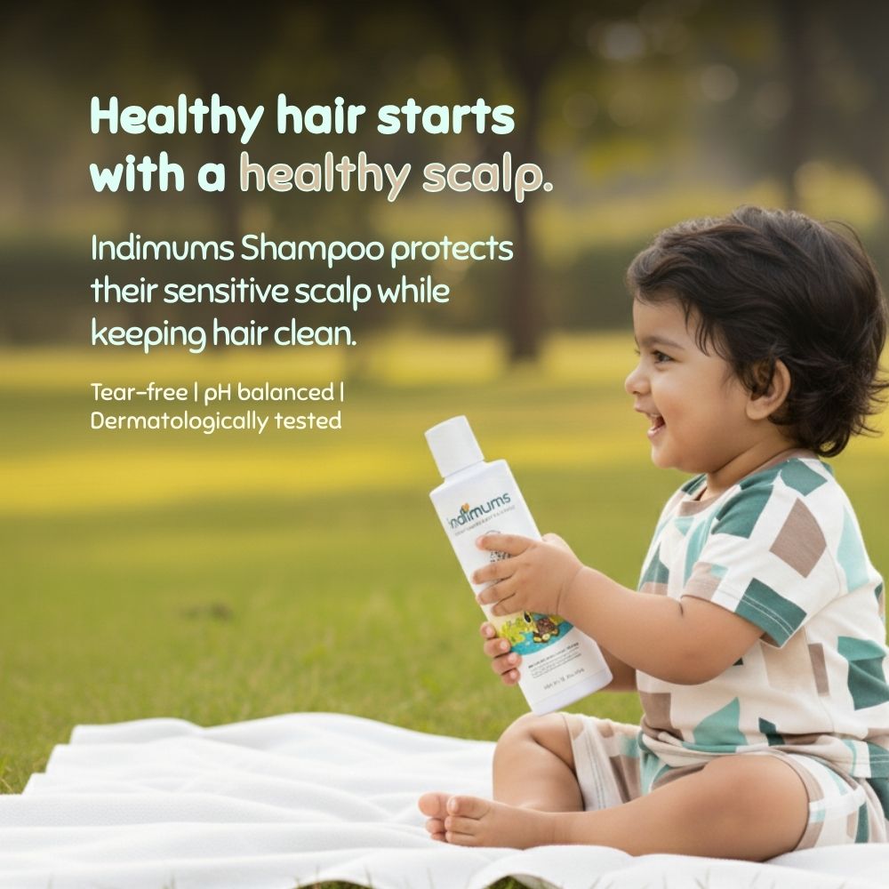 Child holding a bottle of Indimums Shampoo with text about its benefits on a grassy background