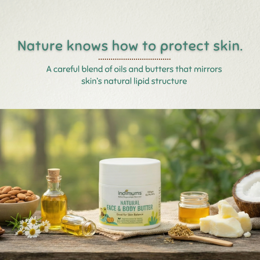 Indimums natural baby face and body butter with ingredients on a wooden table outdoors.