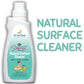 A white bottle of "The Indi Mums" Natural Surface Cleaner with soapnut (Reetha) ingredients, featuring a teal gradient label with product information and a cartoon illustration of a child playing with toys. Large text on the right reads "NATURAL SURFACE CLEANER" in teal letters.