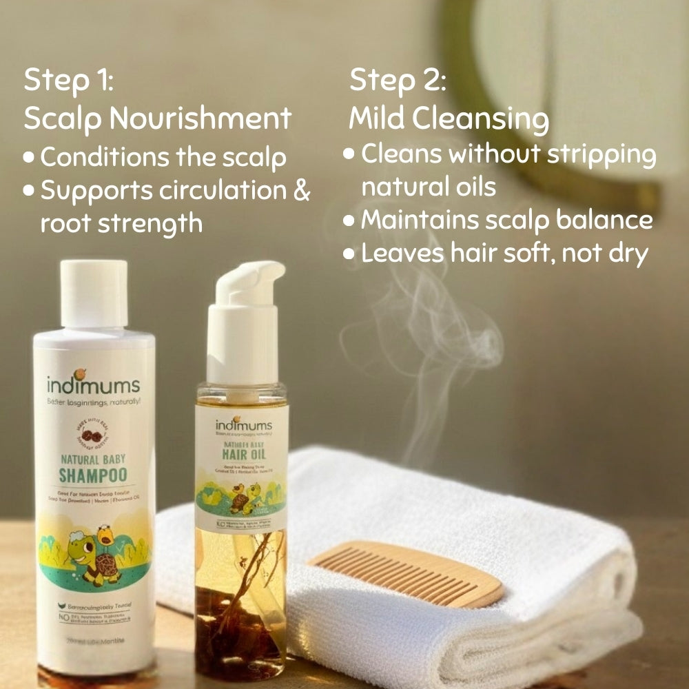 Two bottles of Indimums hair oil & shampoo on a wooden surface with a towel and comb in the background.