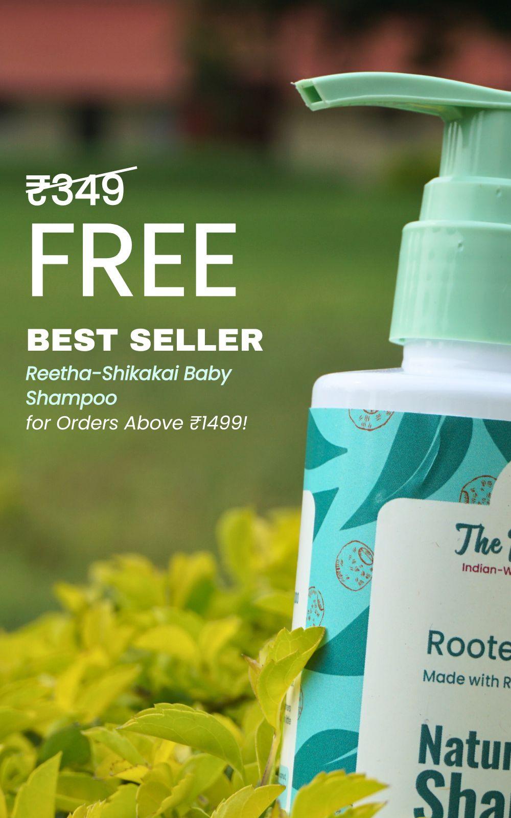 A bottle of Reetha-Shikakai Tear-free Baby Shampoo by The Indi Mums, labeled as a best seller and free with orders over ₹1499.