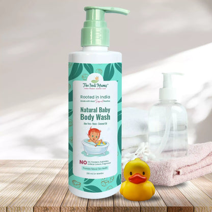 A bottle of The Indi Mums Natural Baby Body Wash, made with Aloe Vera, Neem, and Coconut Oil. The product is gentle, cleanses, and moisturizes baby's delicate skin. It is free from harsh chemicals and is suitable for everyday use.


