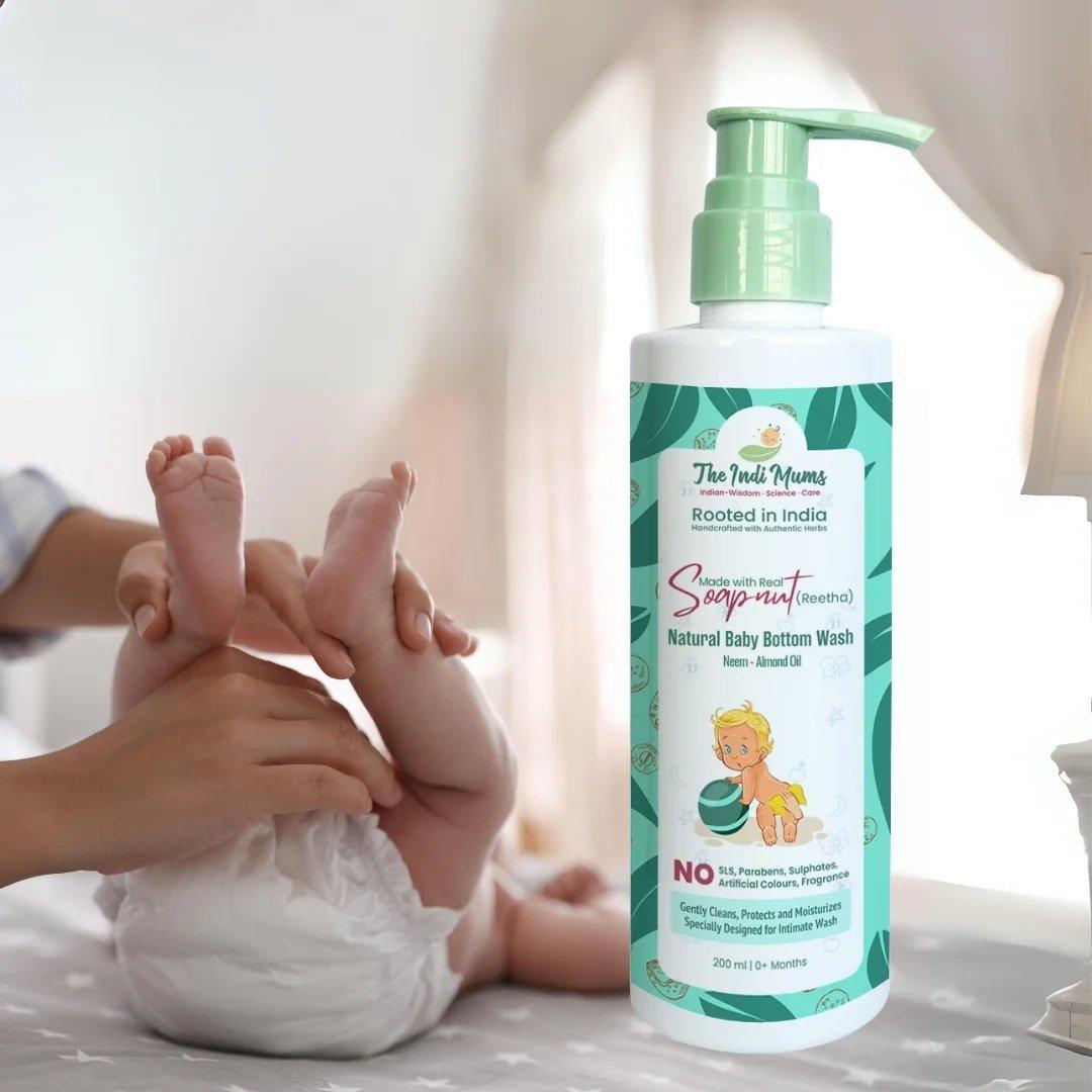 A bottle of The Indi Mums Natural Baby Bottom Wash, highlighting its natural ingredients like neem and almond oil, and its gentle formula for baby's delicate skin.

