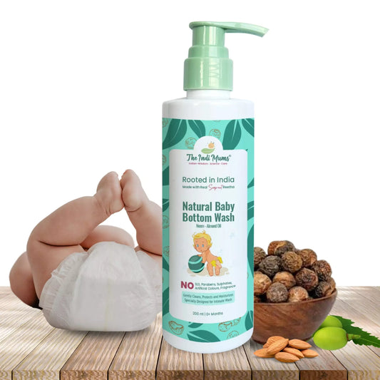 A bottle of The Indi Mums Natural Baby Bottom Wash, made with Neem and Almond Oil. The product is gentle, cleanses, protects, and moisturizes baby's delicate skin. It is free from harsh chemicals and is specially designed for intimate washes.


